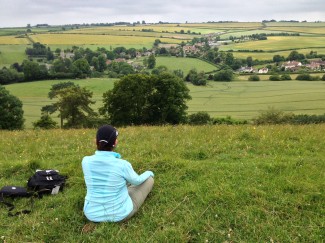 Lady sitting on hillside