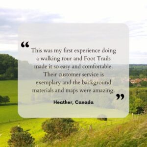 Text showing a glowing review from a Foot Trails guest. In the background, is an image of rolling fields and and trees stretching off ito the distance.