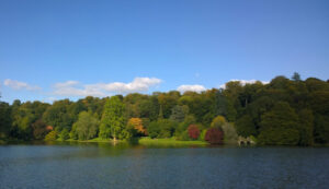 View of lake with autumn trees in the background