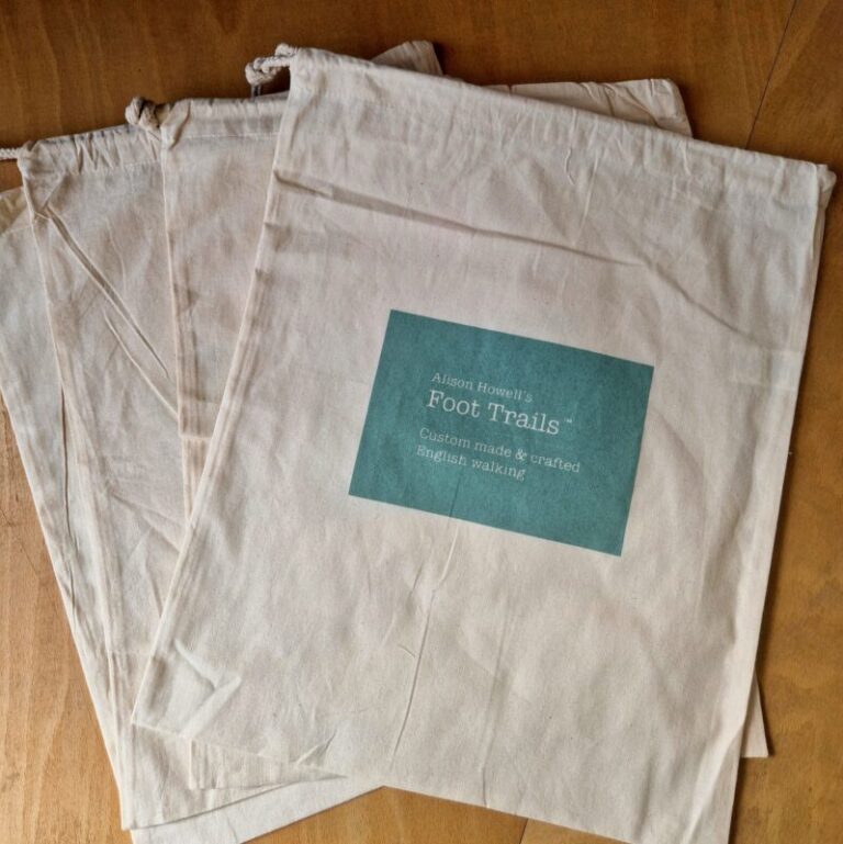 A selection of Foot Trails' branded boot bags