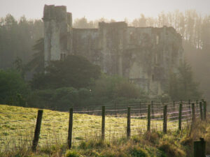 View of an ancient castle ruin in the autumn mist