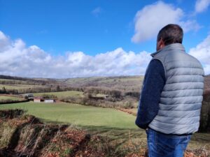 Photo of a person looking out over the Exmoor landscape