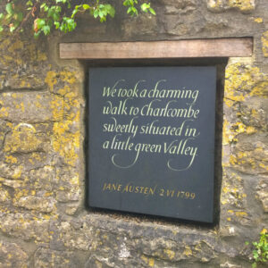 A plaque embedded in a wall showing a Jane Austen quote
