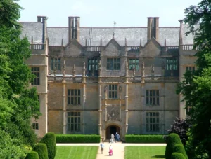 A grand Elizabethan country house in South West England surrounded by a landscaped garden