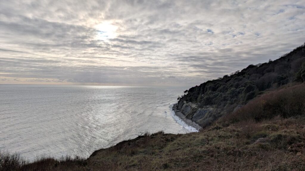 A view of the cliffs of the Dorset Coast with the sea off to the left.
