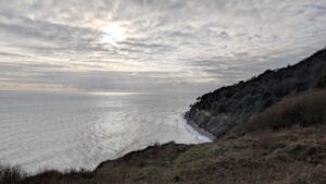 A view of the cliffs of the Dorset Coast with the sea off to the left.