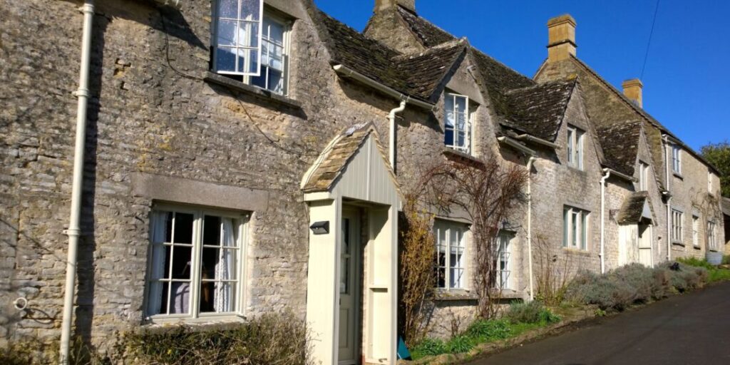 A row of old stone cottages in the Cotswolds