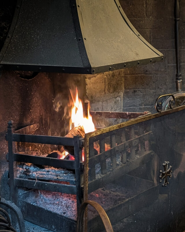 An open wood fire burns invitingly in a village pub.