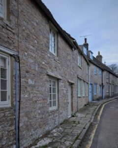 A row of old stone cottages in a coastal village in Dorset.