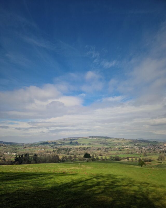 View of the rolling Cotswolds countryside on a sunny day