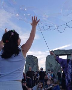 Photo of crowds gathered at Stonehenge to welcome the sunrise on the summer solstice