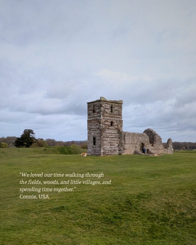 Ancient church ruins sit in the middle of a Neothlic henge with green fields stretching off into the horizon.