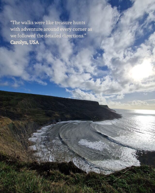 View of a secluded bay from the surrounding cliffs. A guest quote is placed in the top left corner: “The walks were like treasure hunts with adventure around every corner as we followed the detailed directions.” Carolyn, USA